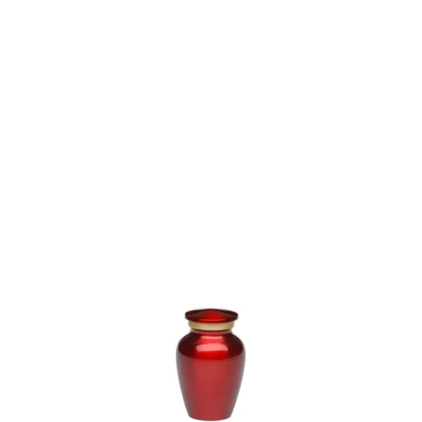 Brass memorial cremation urn, shiny red with gold band, keepsake size